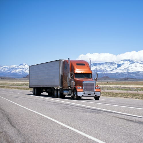 Man in Pink Dress Shirt Holding Pen